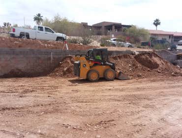 Buffalo Drive Property in Fountain Hills Building a house pad in Fountain Hills and back filling retaining walls.