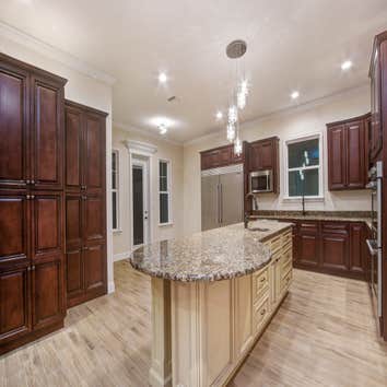 Custom Home in Harmony, FL Custom Single-Family Home with 4 Bedcrooms, 5 Baths, Study, Theater Room, Game Room, Outdoor Living Space and more!