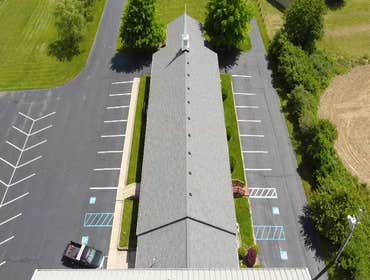 Bethel Missionary Removed existing 3-tab roof and replaced with Owen Corning arch. shingles.