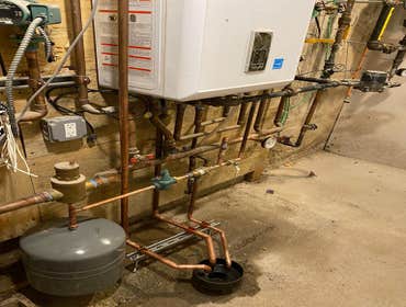 Photos by 2m Mechanical LLC #5 Tankless combo boiler heat and hot water to Get more space at the basement