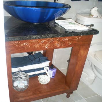 New Hope bathroom Made bathroom bigger, installed pocket door, built in cabinet, custom vanity, wall faucet, water closet, floor and wall tile, exaust 