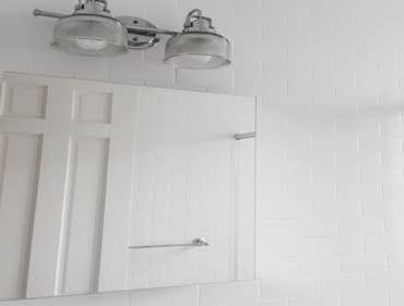 Upper West Side Our work for this project included full gut renovation with exposed brick wall, Calacatta countertop, and glass shower. Bathroom with c