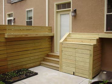 Toner Carpentry Project 2 City project - Trash can storage and shelved garden set up.