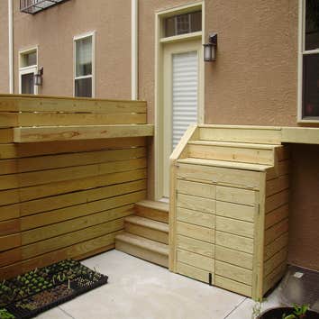 Toner Carpentry Project 2 City project - Trash can storage and shelved garden set up.