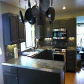 Lake Stevens Kitchen Remodel We installed a porcelain tile counter top and backsplash accented with aluminum strips and squares. Aluminum flat bar was