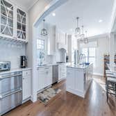 Custom Kitchen This custom kitchen was achieved by opening up bearing walls to the Family room for open plan living.