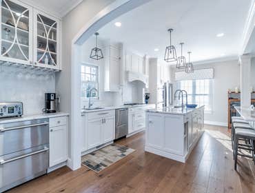Custom Kitchen This custom kitchen was achieved by opening up bearing walls to the Family room for open plan living.