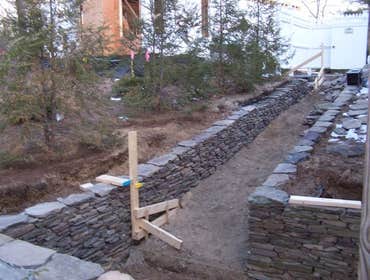Lewis Landscaping Inc Project Residential & commercial lawn maintenance. landscaping, rock, stone, wall, patio, & walkway construction.