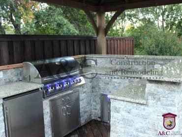 Photos by A&c Construction & Remodeling #13 20 ln ft Outdoor kitchen and firepit