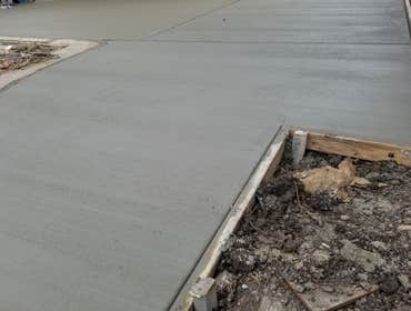 Driveway We demo an old cracked driveway, install rebar and proceed to pour concrete. We also added concrete on the right side of existing driveway f