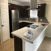 Photos by Grandstone Builders Inc #1 REMODEL TWO BATHROOMS AND REMOVE KITCHEN WALL TO HAVE A OPEN CONCEPT, REMODEL KITCHEN CABINETS WITH GRANITE COUNTE