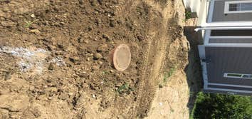 Manhole Projects Shows the digging up and raising of manholes with adapter seals put on, also the grading out and finished product.