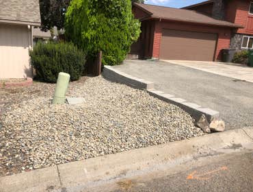 Photos by Houston Construction LLC #1 Excavation of area 8” down, developed a retaining wall , trucked in 21 tons of gravel to make a extra parking are