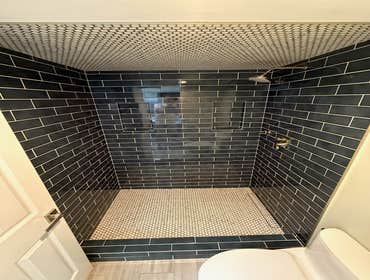 Photos by Purflo plumbing LLC #1 Custom 3’x5 subway tiled shower with mitered joints