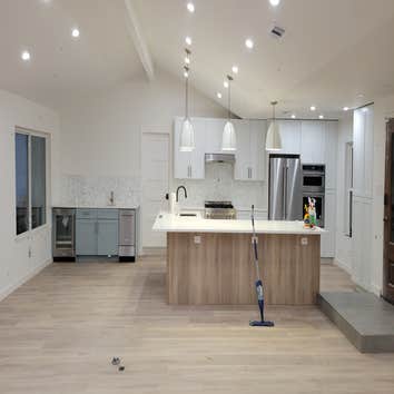 Photos by Rojas Acquisitions LLC #1 Water damaged house, full interior remodel done. Opened up living room area to make for a open space concept on kit
