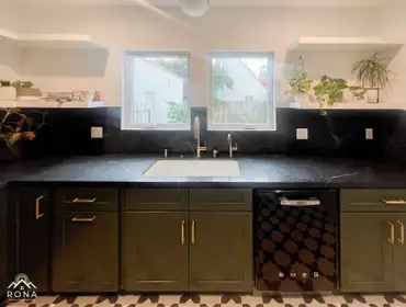 Los Angeles Kitchen Remodel We turned this Los Angeles kitchen into your bold, chic haven! Imagine deep green cabinets with brass handles and black mar