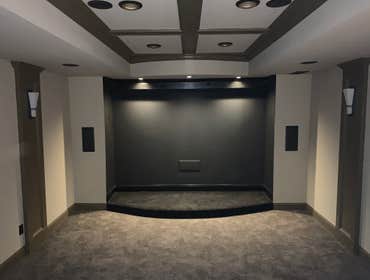 Photos by JNB Development Basement buildout with custom bar and theater room.