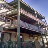 6 family porch rehab 34 feet from roof to ground of pure rotted decks had to come down and go up completely new