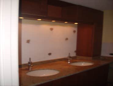 optima views condominiums Remodeling of entire Kitchen And Bathroom new cabinetry, flooring, and stone wall .