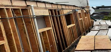 Photos by Santiago's Bay Builders Inc #1 Remodeling half of the building