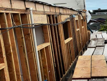 Photos by Santiago's Bay Builders Inc #1 Remodeling half of the building