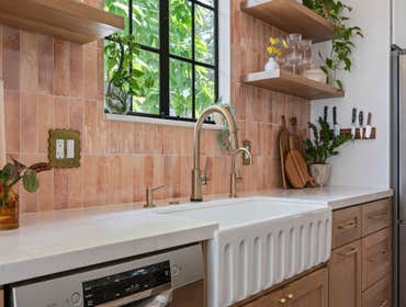 Warm Contemporary Kitchen Remodel in Sacramento, CA 95818 This inviting kitchen remodel combines natural oak cabinetry, fun pink tile, and quartz count
