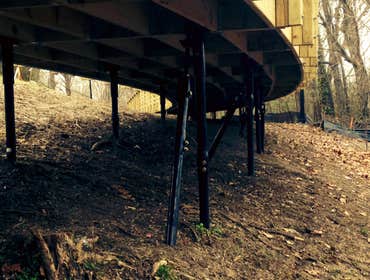 Photo(s) from RamJack Mississippi LLC Boardwalk helical piles with battered piles. Bridge abutment piles