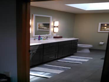 Bathroom with W.E. Davies + Sons Remodeling Remodeled bathroom with shower bench and skylight!