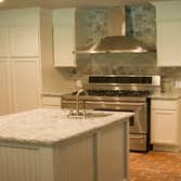 Edmond House Complete gut remodel of 1980's home- updated kitchen (kept original brick floors), updated floor plan, custom built cabinetry, etc.