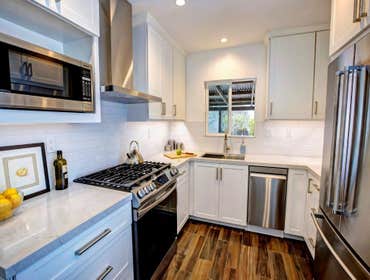 Kitchen Claremont Complete Kitchen Remodel, Quartz counters, white Shaker doors style, under cabinet lighting, new pocket door, pantry cabinet flush mo
