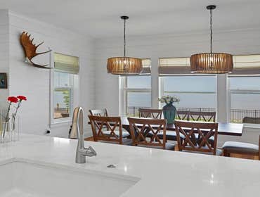 Bells River Residence Nestled in the serene Waterman’s Bluff in Yulee, FL, this exquisite home offers 3,046 sq ft of living space, expanding to a total