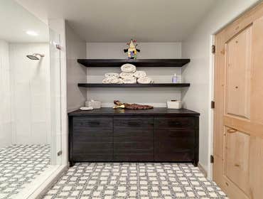 Custom bathroom storage with floating shelves in Venice Los Angeles remodel