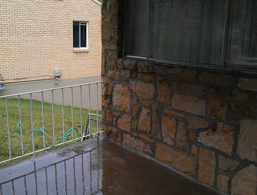 Project photos from Hollis Contracting Removed the original layer of the front house and faced it with sand stone.