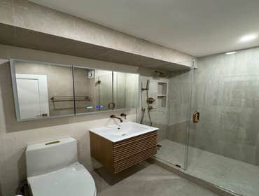 Bathroom Gut Renovation Evolution Group completed a full bathroom gut renovation, including demolition, reconfiguration of the layout, and installation