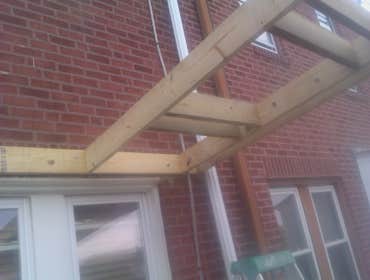 Photo(s) from Laur Moor Construction Two decks and a tiled kitchen floor