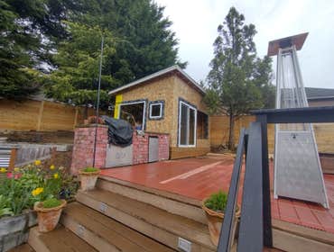 Photos by Stewart & Son Gate & Fence LLC #1 Tiny House with pergola. Small house 17' by 12' small bathroom with pocket door, and small sink with water 