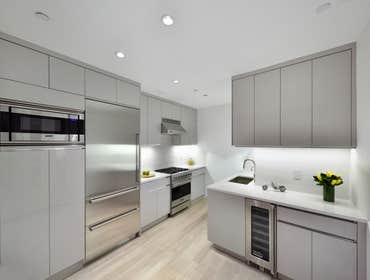 Duplex on Fifth Ave This amazing duplex project brought together clean lines and austere shades of grey to transform the airy downstairs spaces and coz