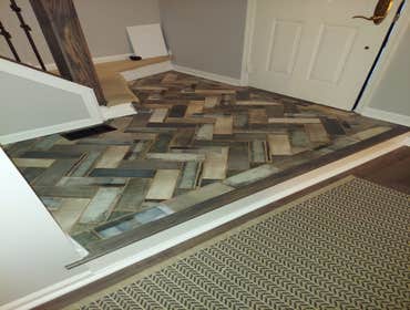 Photos by Porterrobert LLC #11 Remodel kitchen, first floor hardwood flooring, and front entrance remodel.