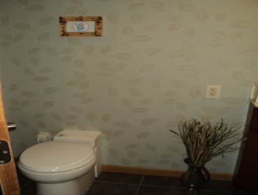 Upflush toilet in basement