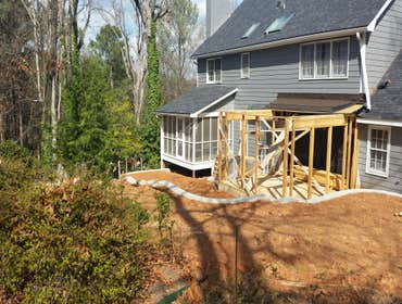 In sandy planes ga a new retaining wall and a sun room addition