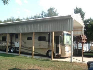 Cheap Pole Barn Special : The RV Port Building Dimensions : 18'W x 40'L x 14'H ( RV Port )
<a href="http://cheappolebarn.com/garages-special-the-rv-po