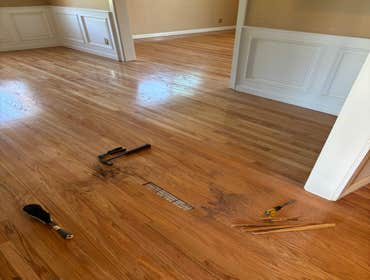 Photos by Floormasters & Design #1 Hardwood floor sanding and refinishing with some repairs.