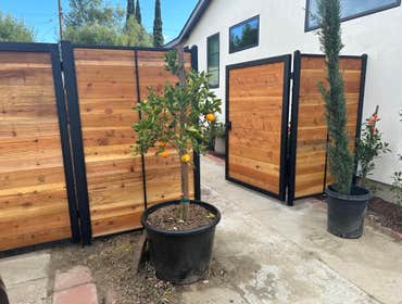 Outdoor Fence between neighbors, and in front of each driveway. Custom built by Westside Home Builders
