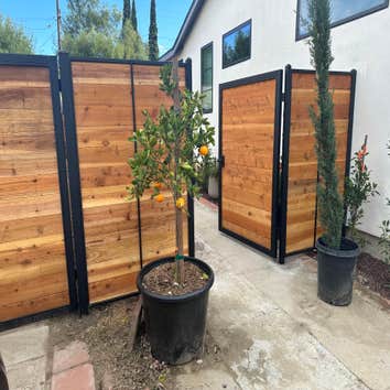 Outdoor Fence between neighbors, and in front of each driveway. Custom built by Westside Home Builders