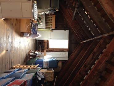 Attic Remodel We turned this unused attic space into a bedroom with lots of shelves and closet space.
