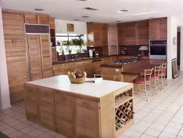 1981: Warm & Open Kitchen Major Kitchen remodel entailed removing two adjoining bearing walls, bordering a small corridor kitchen, to completely open t