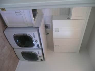 LAUNDRY ROOM #2 Pretty standard room adding:
-Sink
-Full cabinetry
-Folding counter over washer & dryer