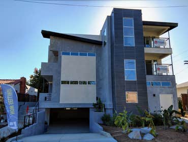 Hugo Bay Townhomes - Point Loma Demolition of an old house on an in-fill city lot and construction of a new 4 unit building with underground garages. E