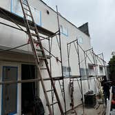 Photos by Santiago's Bay Builders Inc #1 Remodeling half of the building