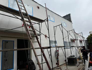 Photos by Santiago's Bay Builders Inc #1 Remodeling half of the building
